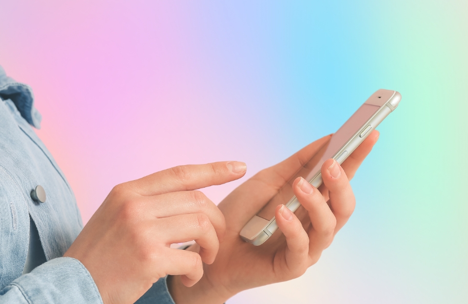 Woman with hyperhidrosis using mobile phone